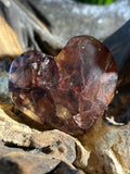 This exquisite Fire Quartz heart, measuring 2.5 inches wide and 2 inches high,