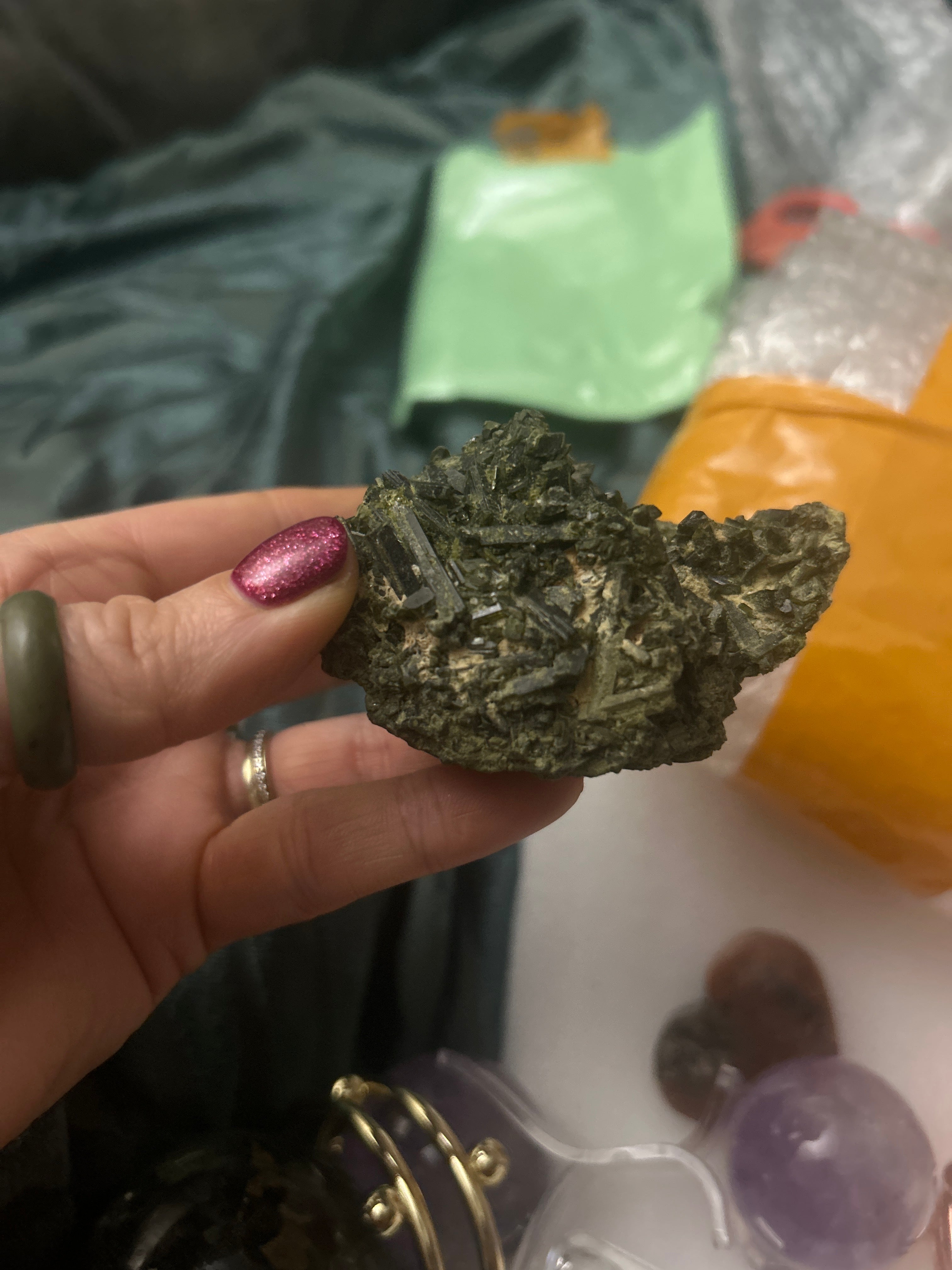 This is a cluster of dark green epidote crystals
