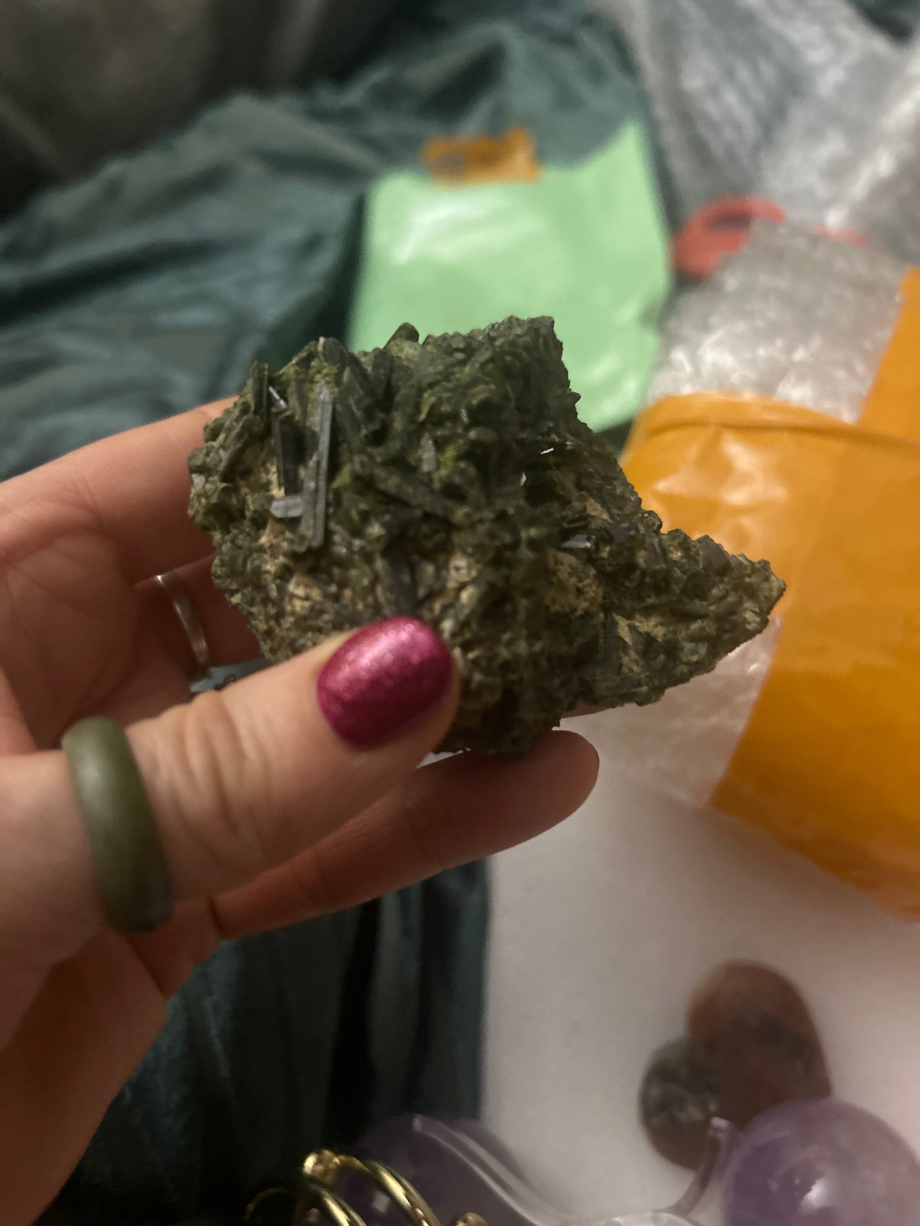 This is a cluster of dark green epidote crystals