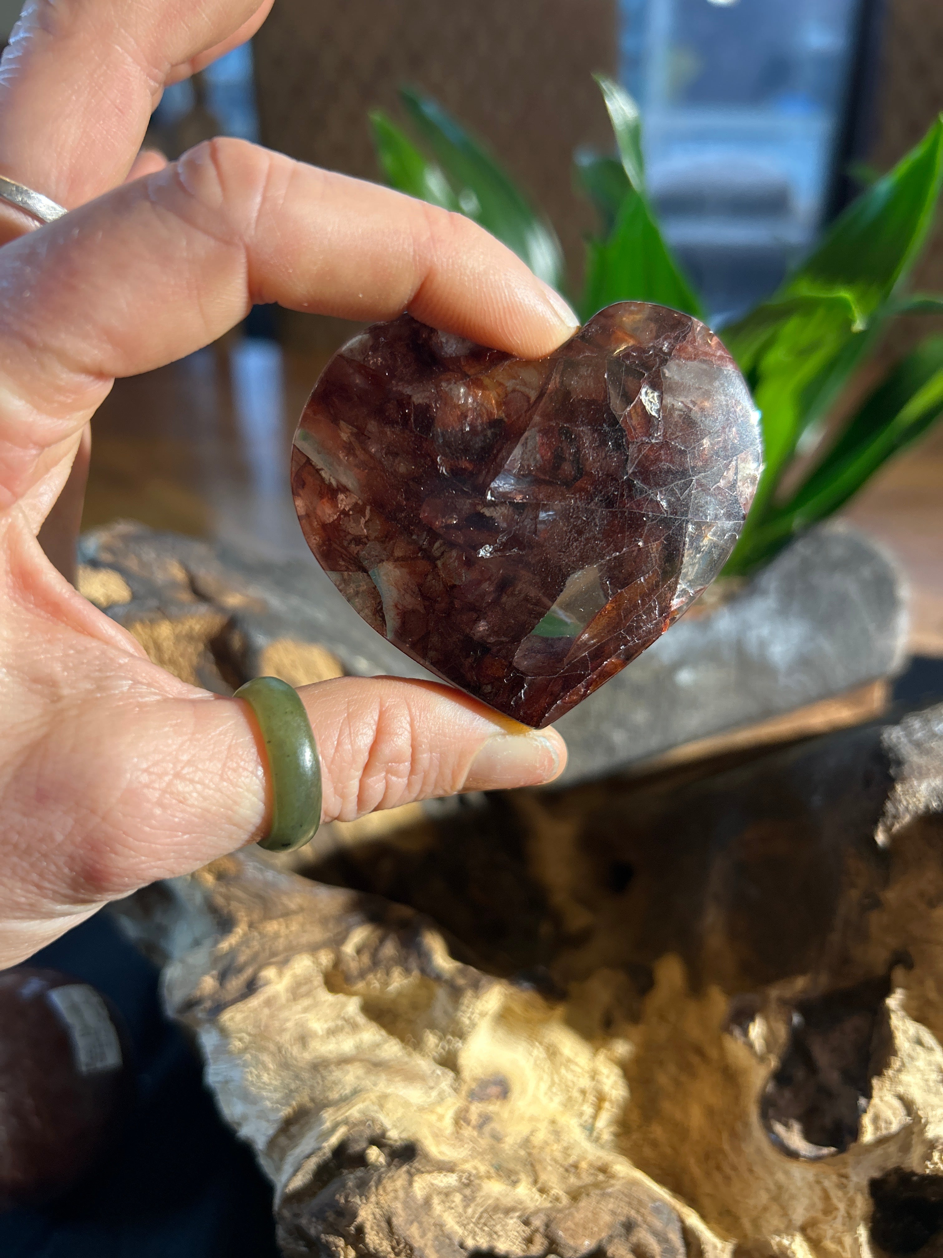 This exquisite Fire Quartz heart, measuring 2.5 inches wide and 2 inches high,